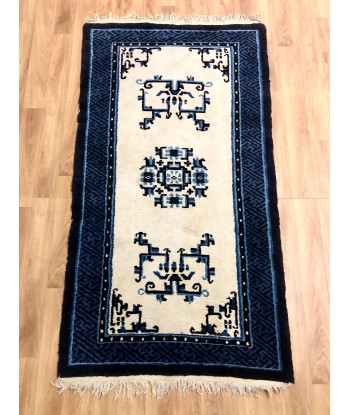 Tapis bleu motifs ethniques les muscles