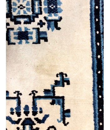 Tapis bleu motifs ethniques les muscles