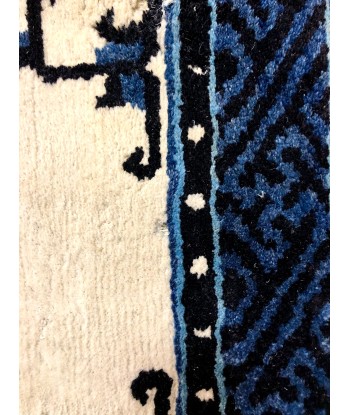 Tapis bleu motifs ethniques les muscles